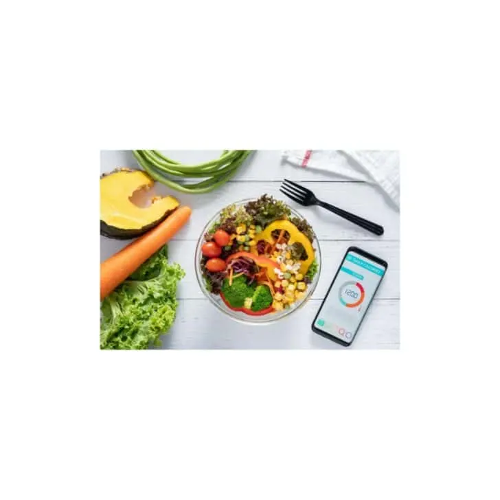 Bowl of healthy food for weight loss with cellphone calculating calories.