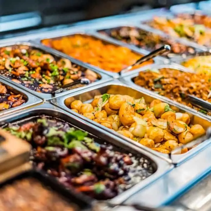 An array of food in trays ready to serve